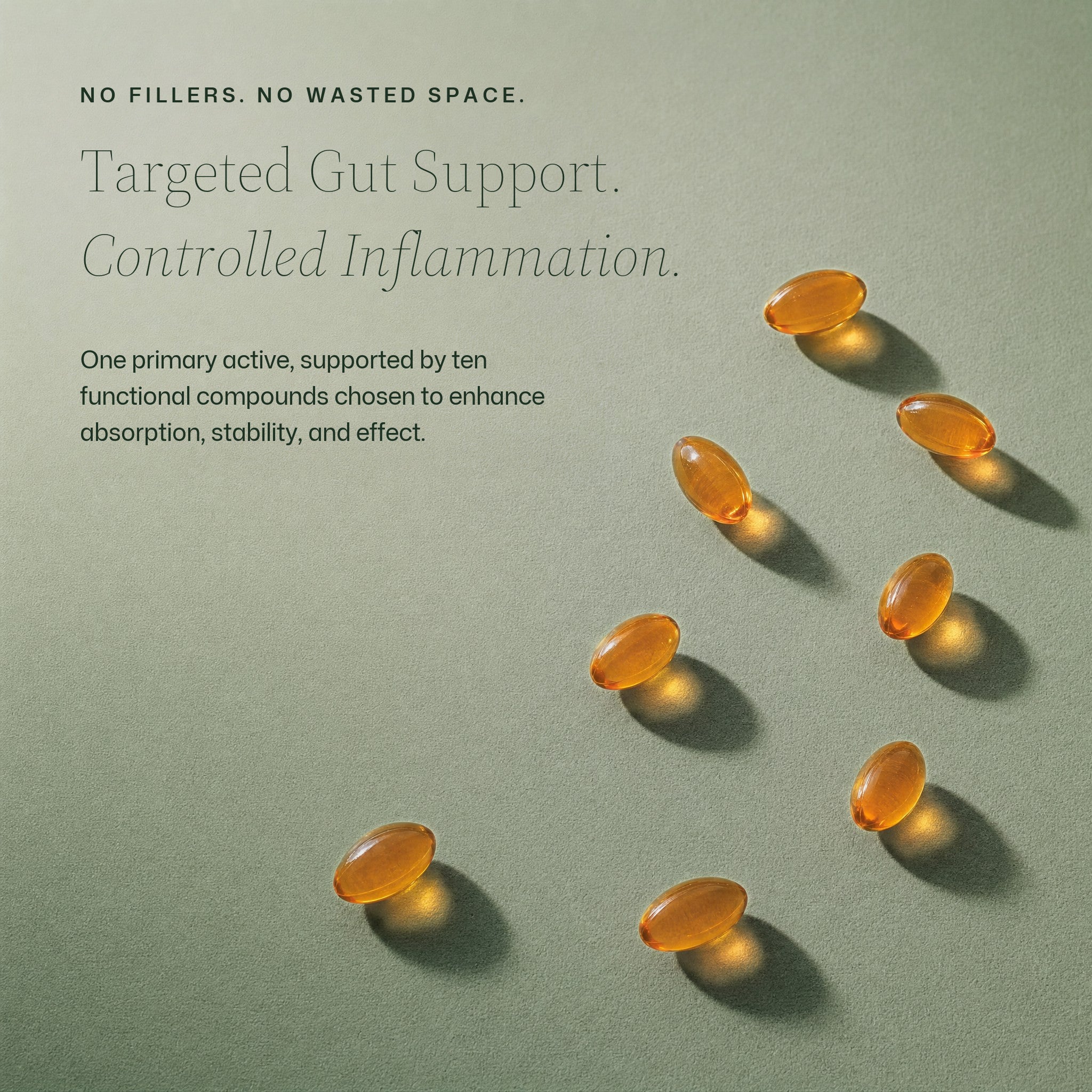Small orange Wild Oregano softgels scattered on a pale sage surface in hard sunlight: no fillers, no wasted space — targeted gut support and controlled inflammation from one primary active, supported by ten functional compounds chosen to enhance absorption, stability and effect.