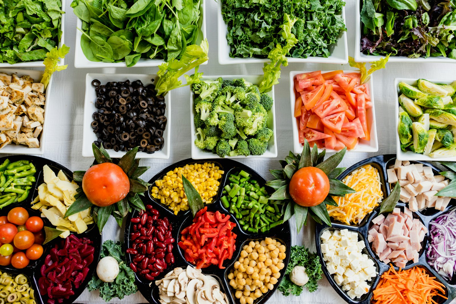 Mediterranean vegetables, herbs and whole-food ingredients arranged for a diet-first wellness guide
